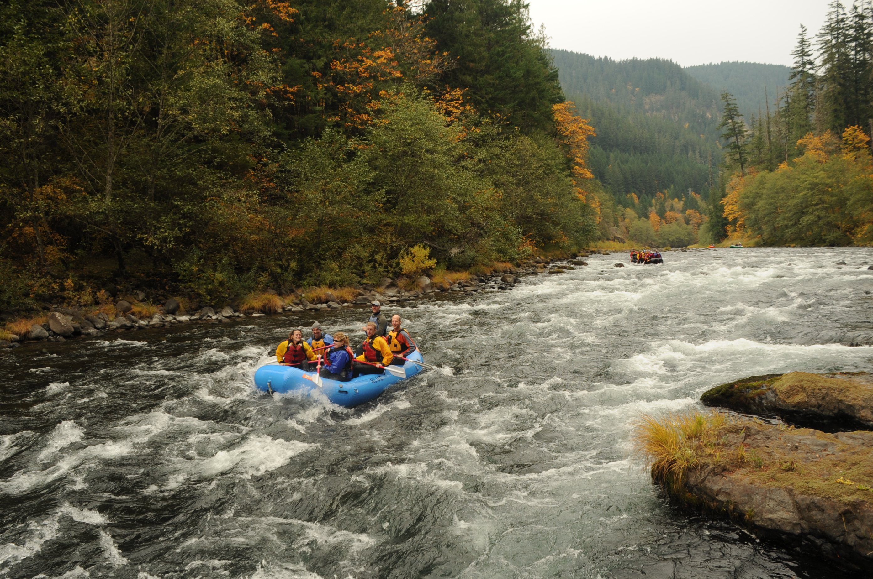 Image of rafters on the Clackamas River enjoying the river in fall.