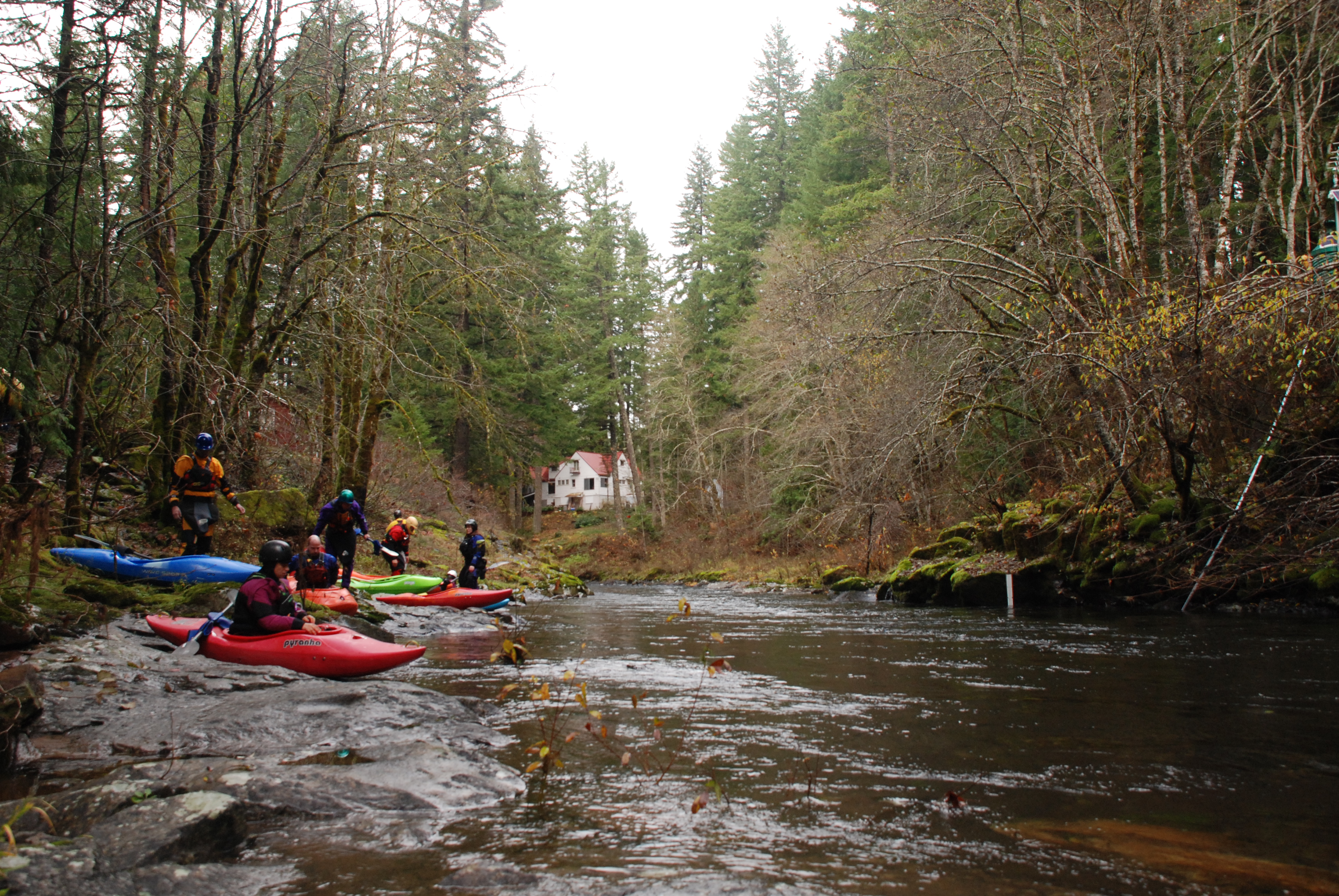 Kayakers preparing to launch at the Stabler Access on the Wind River, WA.